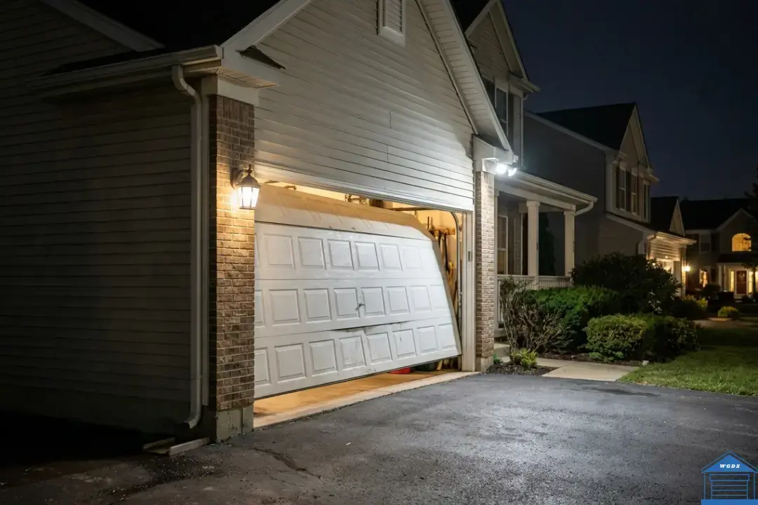broken garage door in wheaton il requiring emergency repair at night 1080x720 1 broken garage door requiring emergency repair in wheaton, IL