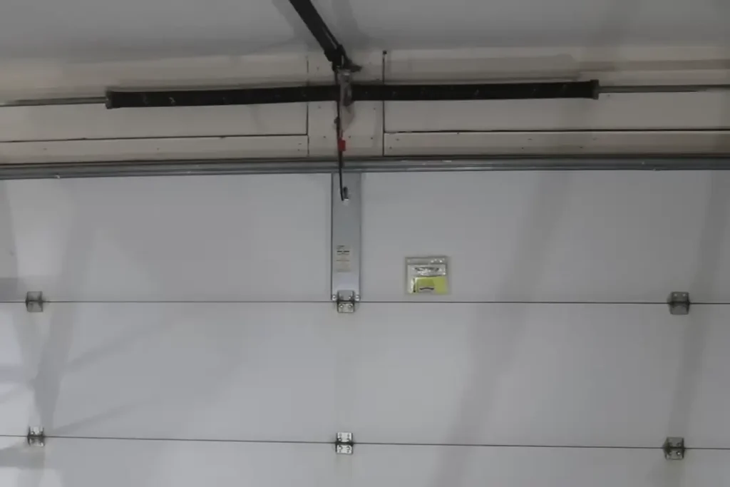 garage door in wheaton with broken garage door spring 1080x720 1 A broken garage door torsion spring in Wheaton, IL